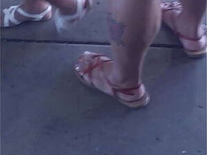 Hot latex clad blonde in high heels and William Wylde designer dress